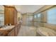 Expansive bathroom features dual vanity, frameless shower, soaking tub, and private toilet area at 8016 Bounty Ln, Bradenton, FL 34202