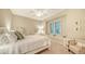 Bright bedroom featuring neutral walls, a ceiling fan, and a comfortable queen-size bed with white linens at 8016 Bounty Ln, Bradenton, FL 34202