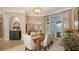Formal dining room with seating for six, light colored walls, and french doors that lead to the outdoors at 8016 Bounty Ln, Bradenton, FL 34202