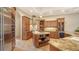 Well appointed kitchen featuring custom cabinetry, stainless appliances, and granite countertops at 8016 Bounty Ln, Bradenton, FL 34202
