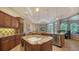 Gourmet kitchen features granite countertops, custom cabinetry, and stainless steel appliances at 8016 Bounty Ln, Bradenton, FL 34202