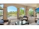 Relax on the lanai and enjoy the view of the pool and outdoor jacuzzi with the beautiful greenery in the background at 8016 Bounty Ln, Bradenton, FL 34202