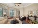 Elegant living room with hardwood floors, comfortable seating, and stylish decor at 8016 Bounty Ln, Bradenton, FL 34202