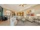 Open concept living and kitchen area with hardwood floors and modern decor at 8016 Bounty Ln, Bradenton, FL 34202