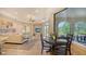Open living room with large windows, fireplace, comfortable seating, and access to the outdoors at 8016 Bounty Ln, Bradenton, FL 34202