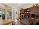 Office space with a large desk, wood built-ins, and decoratively displayed sports memorabilia at 8016 Bounty Ln, Bradenton, FL 34202