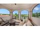 Inviting patio with scenic views, offering a comfortable seating area and tiled flooring, ideal for outdoor relaxation at 8016 Bounty Ln, Bradenton, FL 34202