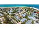 Aerial view of a charming neighborhood with houses, streets, and trees at 802 N Bay Blvd, Anna Maria, FL 34216