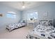 Bright bedroom with two twin beds, a desk and lots of natural light at 802 N Bay Blvd, Anna Maria, FL 34216