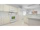 Bright kitchen featuring white cabinetry, modern appliances, and a clean, functional design at 802 N Bay Blvd, Anna Maria, FL 34216