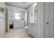 Laundry room featuring a washer, dryer, and custom cabinets for storage at 802 N Bay Blvd, Anna Maria, FL 34216