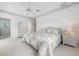 Spacious main bedroom featuring carpeted floors, ceiling fan, and coastal decor throughout at 802 N Bay Blvd, Anna Maria, FL 34216