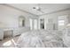Bright main bedroom featuring a closet, desk and access to the balcony at 802 N Bay Blvd, Anna Maria, FL 34216