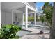 Inviting covered pool area with outdoor seating, promising a relaxing and private backyard retreat at 802 N Bay Blvd, Anna Maria, FL 34216