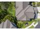 Overhead view of roof, yard, and tropical landscaping at 8073 Tybee Ct, University Park, FL 34201