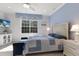 Inviting bedroom featuring a queen bed, blue color palette, and plenty of natural light at 8073 Tybee Ct, University Park, FL 34201