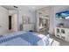 Spacious bedroom with a king bed, modern dresser, and sliding glass doors at 8073 Tybee Ct, University Park, FL 34201