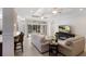 Bright living room with tile floors, comfortable furniture, and a cozy fireplace at 8073 Tybee Ct, University Park, FL 34201