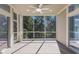 Screened patio with fan showing view of lush landscaping at 8073 Tybee Ct, University Park, FL 34201