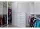 Walk-in closet with custom shelves, drawers and clothing racks at 8073 Tybee Ct, University Park, FL 34201