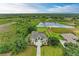 Expansive waterfront home featuring lush landscaping, mature trees and scenic views at 8103 Snowy Egret Pl, Bradenton, FL 34202
