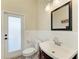 Bathroom with modern sink and door to outside at 8103 Snowy Egret Pl, Bradenton, FL 34202