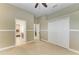 Bedroom with carpet, closet, and entryway to bathroom at 8103 Snowy Egret Pl, Bradenton, FL 34202