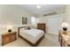 Bedroom with carpet, closet, ceiling fan, and furnishings at 8103 Snowy Egret Pl, Bradenton, FL 34202