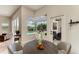 Cozy breakfast nook with view of the pool, including table with seating for four and glass doors at 8103 Snowy Egret Pl, Bradenton, FL 34202