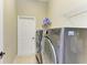 Efficient laundry room equipped with a modern washer and dryer set at 8103 Snowy Egret Pl, Bradenton, FL 34202