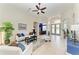 Cozy living room featuring tile floors, neutral colors and a view of the home's entry at 8103 Snowy Egret Pl, Bradenton, FL 34202