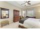Tranquil main bedroom featuring tray ceiling, natural light, and a serene ambiance for relaxation and rest at 8103 Snowy Egret Pl, Bradenton, FL 34202