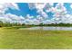 Scenic view of pond surrounded by grassland and foliage at 8103 Snowy Egret Pl, Bradenton, FL 34202