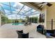 Inviting screened pool area with seating, perfect for outdoor enjoyment and relaxation at 8103 Snowy Egret Pl, Bradenton, FL 34202