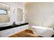 Luxurious bathroom with a freestanding tub, dual sinks, and a modern, spacious design at 838 Norsota Way, Sarasota, FL 34242