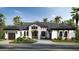 Stunning single-Gathering home with a modern design, beautiful landscaping, and a welcoming front entrance at 838 Norsota Way, Sarasota, FL 34242