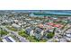 Stunning aerial view of beach condos, showcasing the lush landscaping, proximity to beach and access to beautiful waterways at 845 Benjamin Franklin Dr # 302, Sarasota, FL 34236