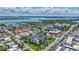 Panoramic aerial view of coastal neighborhood with canal, bay, and residential buildings at 845 Benjamin Franklin Dr # 302, Sarasota, FL 34236