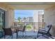 Charming balcony with comfortable seating and views of the lush surrounding landscape, perfect for relaxation at 845 Benjamin Franklin Dr # 302, Sarasota, FL 34236