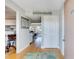 Inviting entryway with wood floors that leads into an open-concept living area, with modern decor at 845 Benjamin Franklin Dr # 302, Sarasota, FL 34236