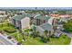 Exterior daytime image of a building complex with tidy landscaping and a swimming pool at 845 Benjamin Franklin Dr # 302, Sarasota, FL 34236