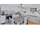 Charming kitchen features a dining area, updated appliances, and unique nautical decor at 845 Benjamin Franklin Dr # 302, Sarasota, FL 34236