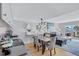Open-concept kitchen and living area featuring modern appliances and seamless flow to the dining space at 845 Benjamin Franklin Dr # 302, Sarasota, FL 34236