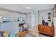 An adjacent area between living room, kitchen and entry shows a casual office with great natural light at 845 Benjamin Franklin Dr # 302, Sarasota, FL 34236