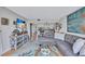 Open living area with stylish decor, hardwood floors, and a clear view into the updated kitchen space at 845 Benjamin Franklin Dr # 302, Sarasota, FL 34236