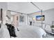 Serene main bedroom with a four-poster bed, bright interior, and stylish furnishings at 845 Benjamin Franklin Dr # 302, Sarasota, FL 34236