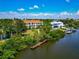 Stunning waterfront homes featuring tropical landscaping and private boat docks at 850 S Tamiami Trl # 431, Sarasota, FL 34236