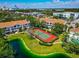 Aerial view of tennis court surrounded by lush landscaping at 850 S Tamiami Trl # 431, Sarasota, FL 34236