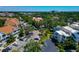 Scenic view of residences, parking, a pond, and lush tropical landscaping at 850 S Tamiami Trl # 431, Sarasota, FL 34236