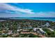 Expansive aerial view of the coastal neighborhood with residences, waterways, and ocean in the distance at 850 S Tamiami Trl # 431, Sarasota, FL 34236
